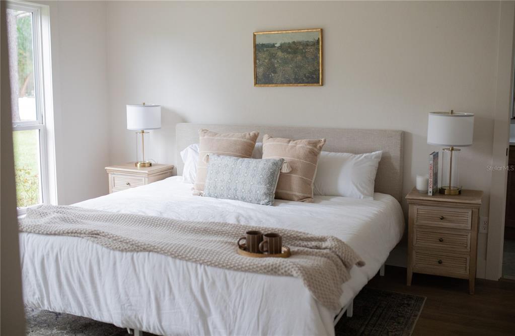 320 Rodeo Road Ormond Beach, FL 32174 - Photo 19 of 53 a bedroom with a bed and a lamp on dresser