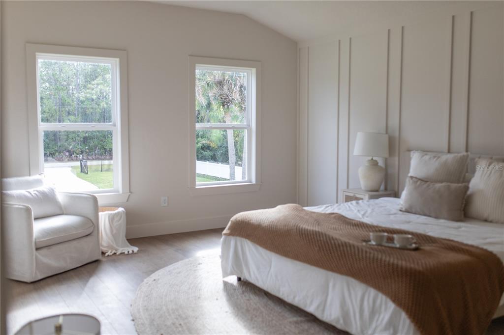 320 Rodeo Road Ormond Beach, FL 32174 - Photo 24 of 53 a bedroom with a bed and a couch with window