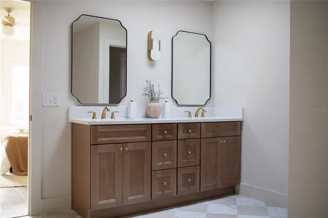 a bathroom with a sink and a mirror