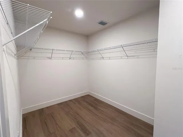 a bedroom with bed and window