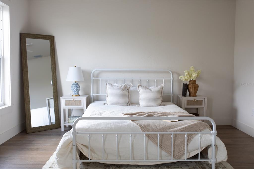 320 Rodeo Road Ormond Beach, FL 32174 - Photo 31 of 53 a bedroom with a bed and wooden floor