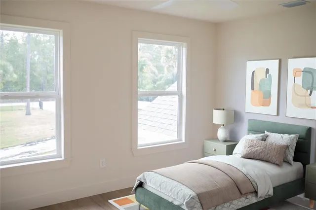 a bedroom with a bed and a chair