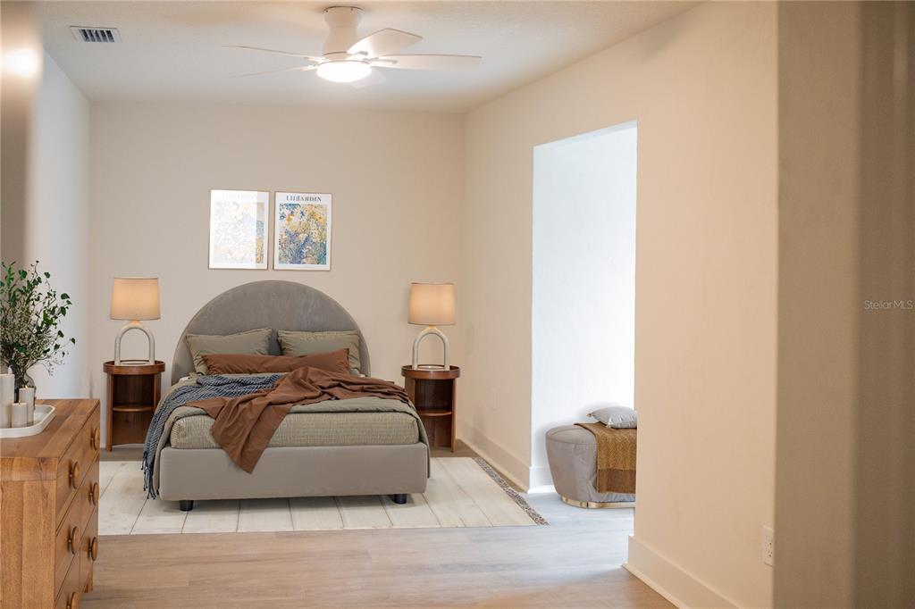 320 Rodeo Road Ormond Beach, FL 32174 - Photo 36 of 53 a bedroom with a bed and wooden floor