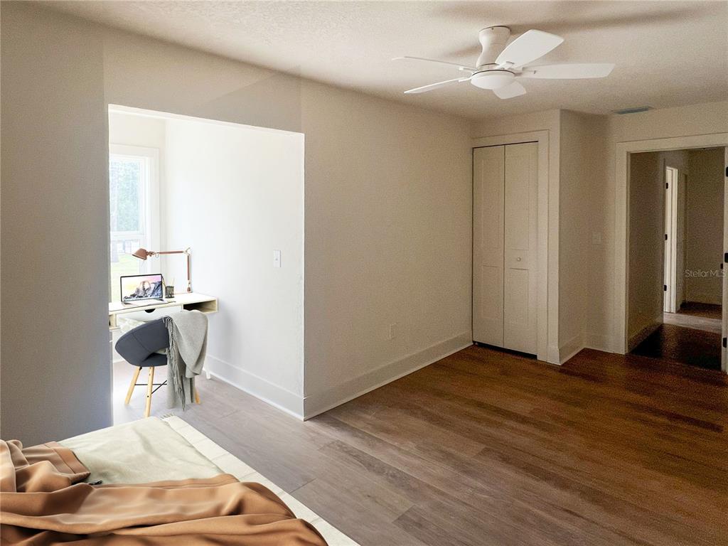 320 Rodeo Road Ormond Beach, FL 32174 - Photo 37 of 53 a bedroom with a bed and a chair