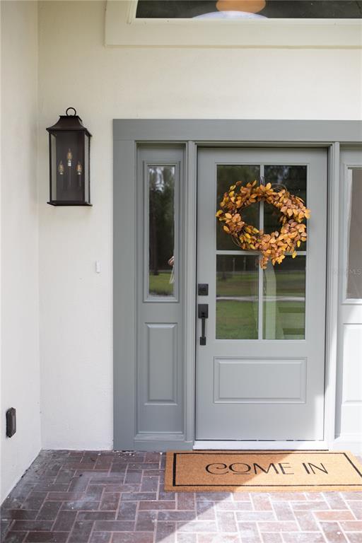 320 Rodeo Road Ormond Beach, FL 32174 - Photo 4 of 53 a view of entryway with a front door