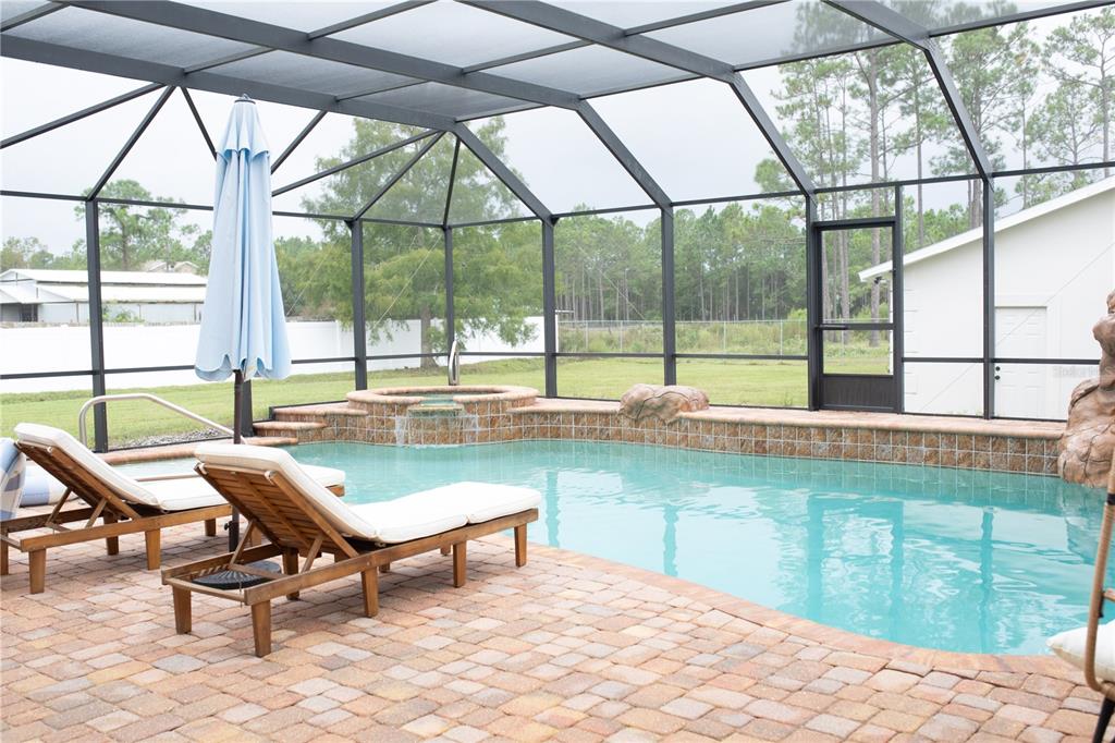 320 Rodeo Road Ormond Beach, FL 32174 - Photo 41 of 53 a swimming pool with outdoor seating and outdoor space