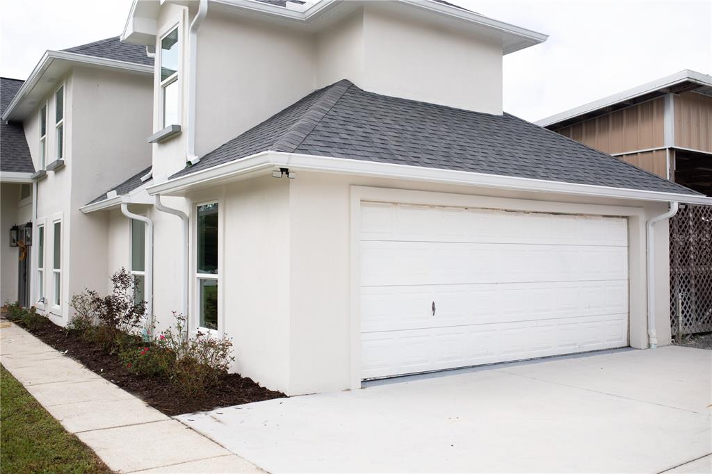 320 Rodeo Road Ormond Beach, FL 32174 - Photo 43 of 53 a view of a house with garage
