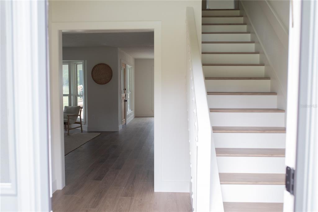 320 Rodeo Road Ormond Beach, FL 32174 - Photo 5 of 53 a view of a hallway with wooden floor and entryway