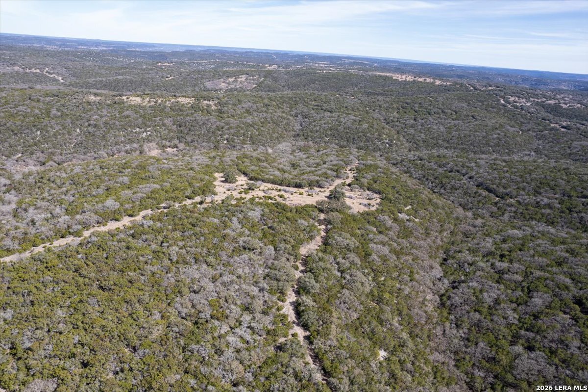 2633 Jackson Creek Road Medina, TX 78055 - Photo 17 of 27 a view of a city with lush green hillside