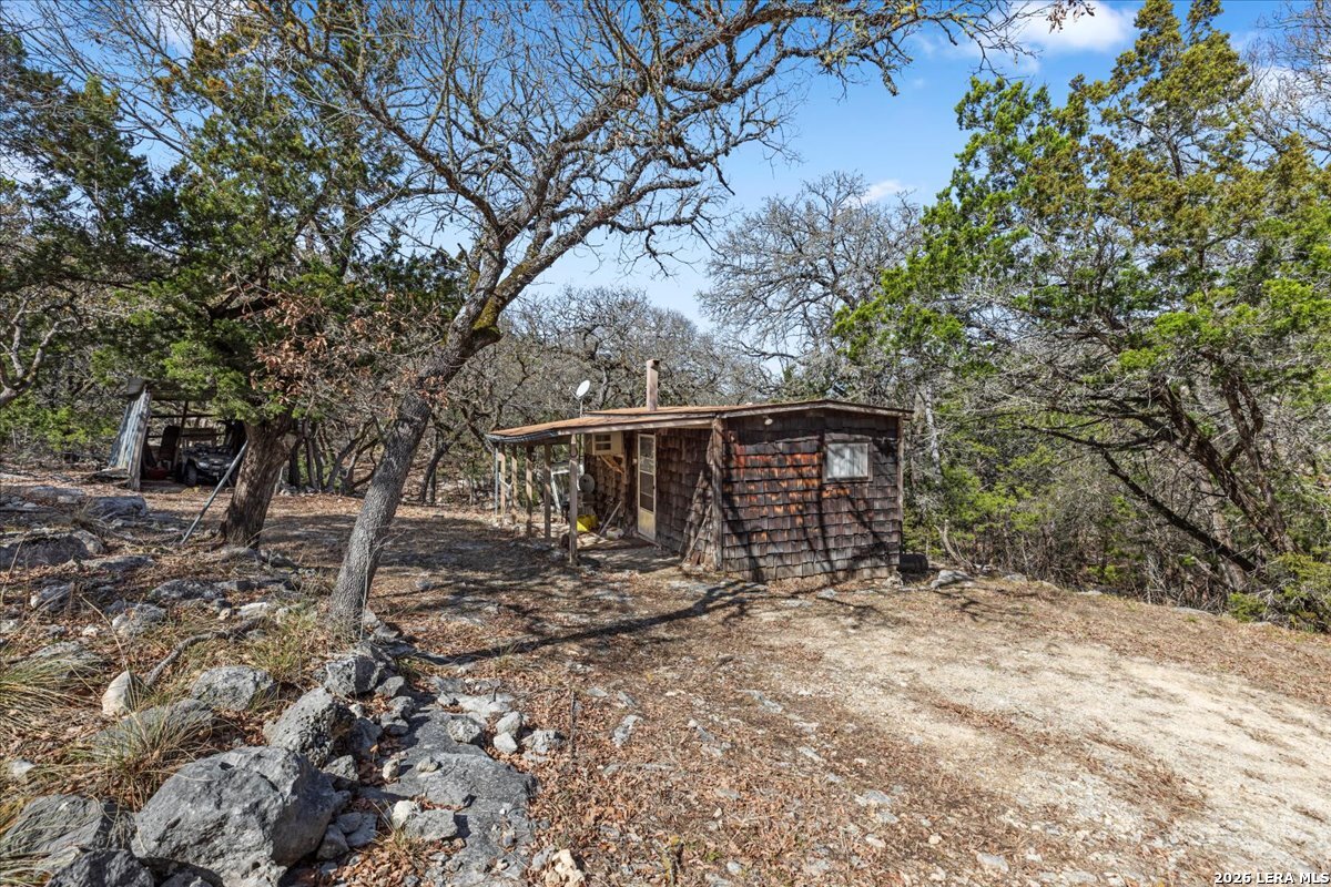 2633 Jackson Creek Road Medina, TX 78055 - Photo 4 of 27 a view of a house with a yard and tree