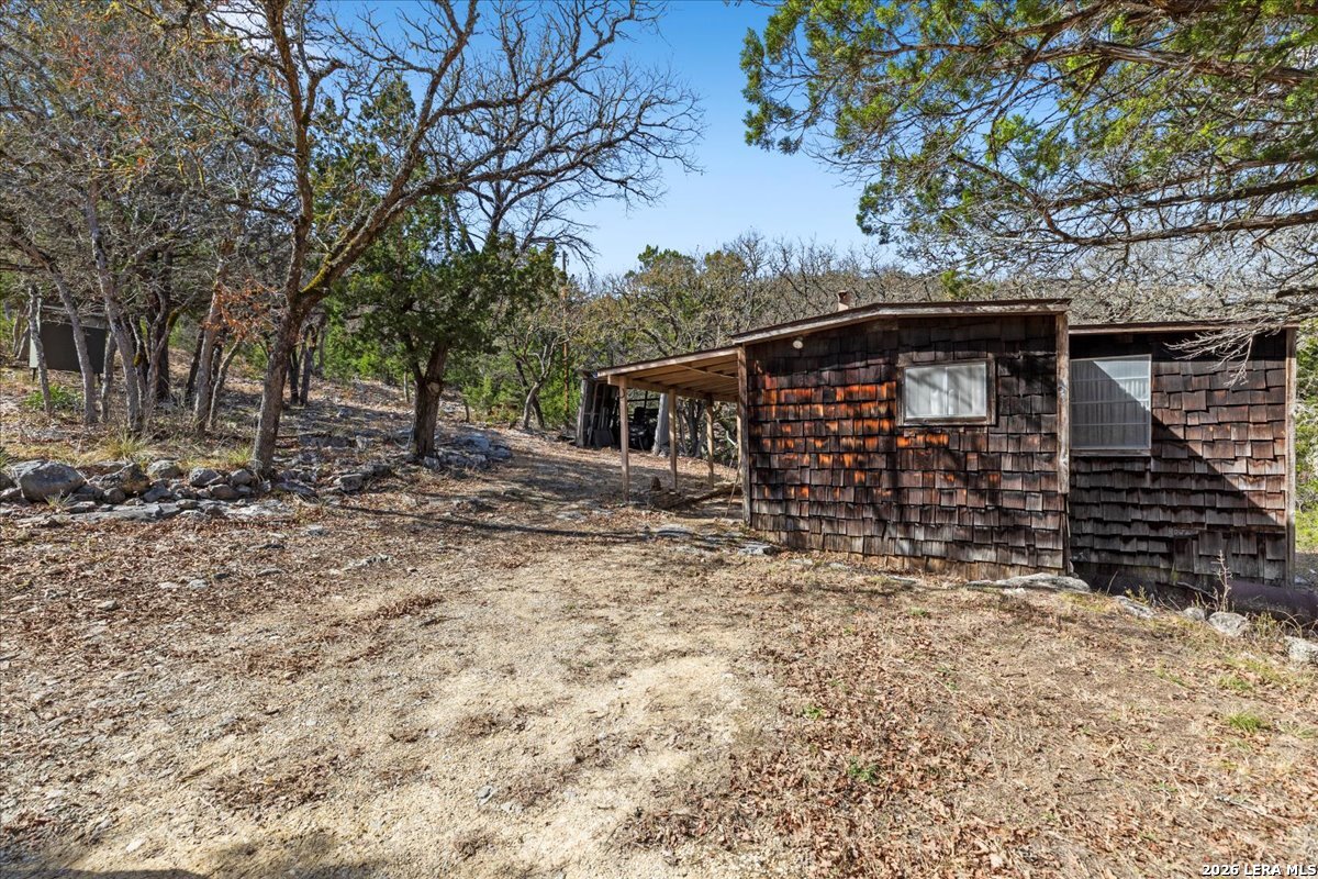2633 Jackson Creek Road Medina, TX 78055 - Photo 5 of 27 a front view of house with small garden