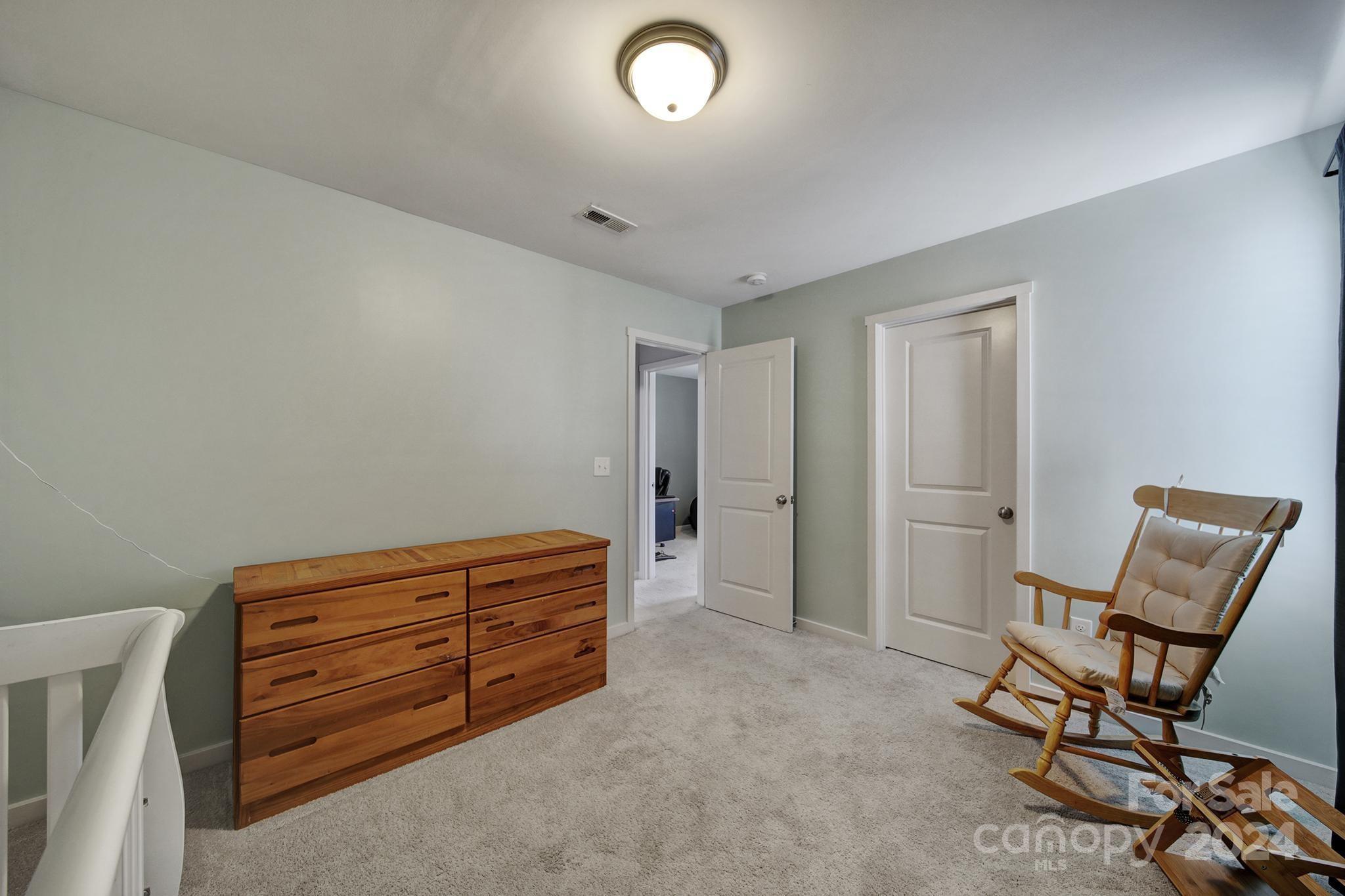 1539 Logan Patrick Court Gastonia, NC 28052 - Photo 16 of 26 a room with furniture and a chair