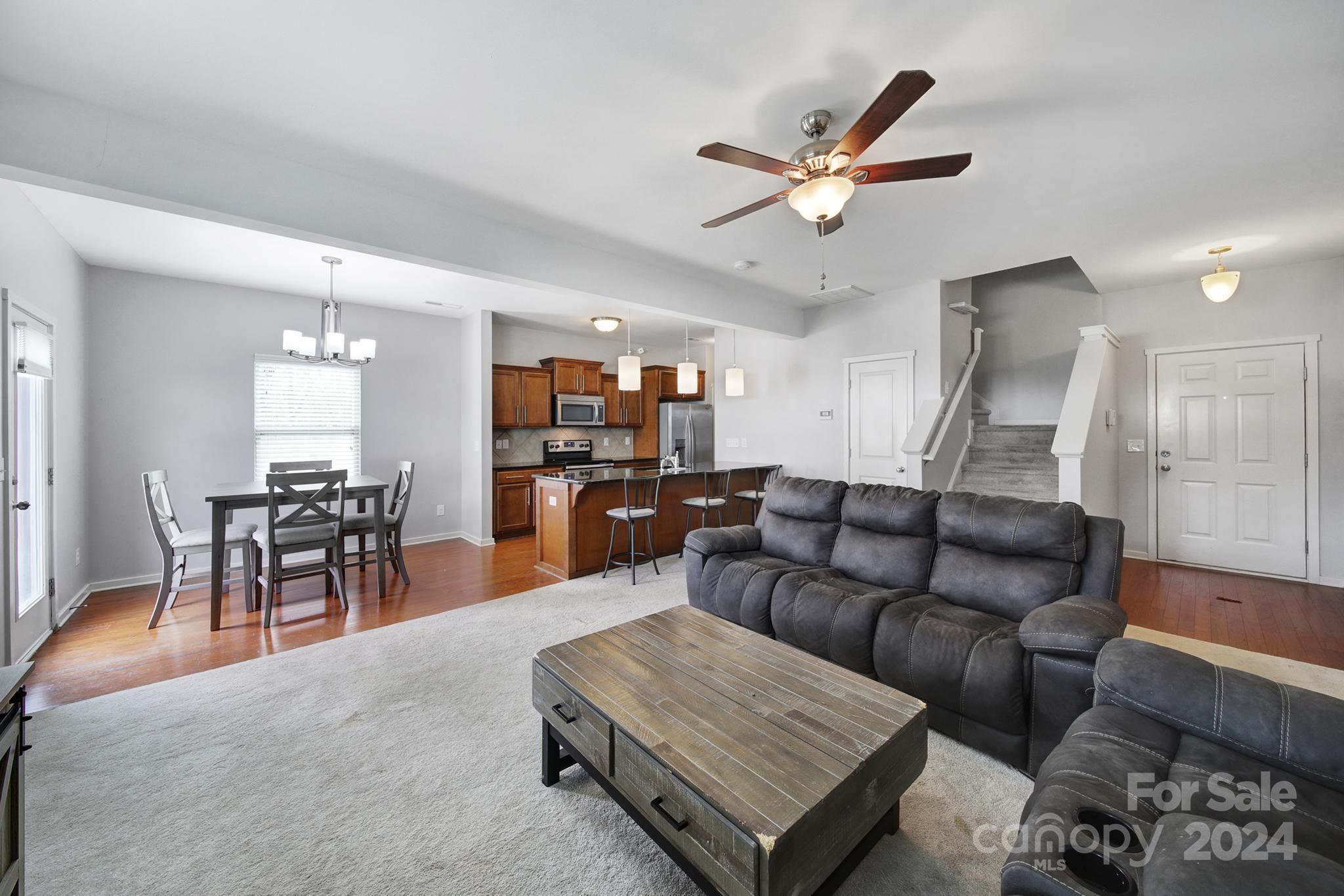 1539 Logan Patrick Court Gastonia, NC 28052 - Photo 3 of 26 a living room with furniture and kitchen view