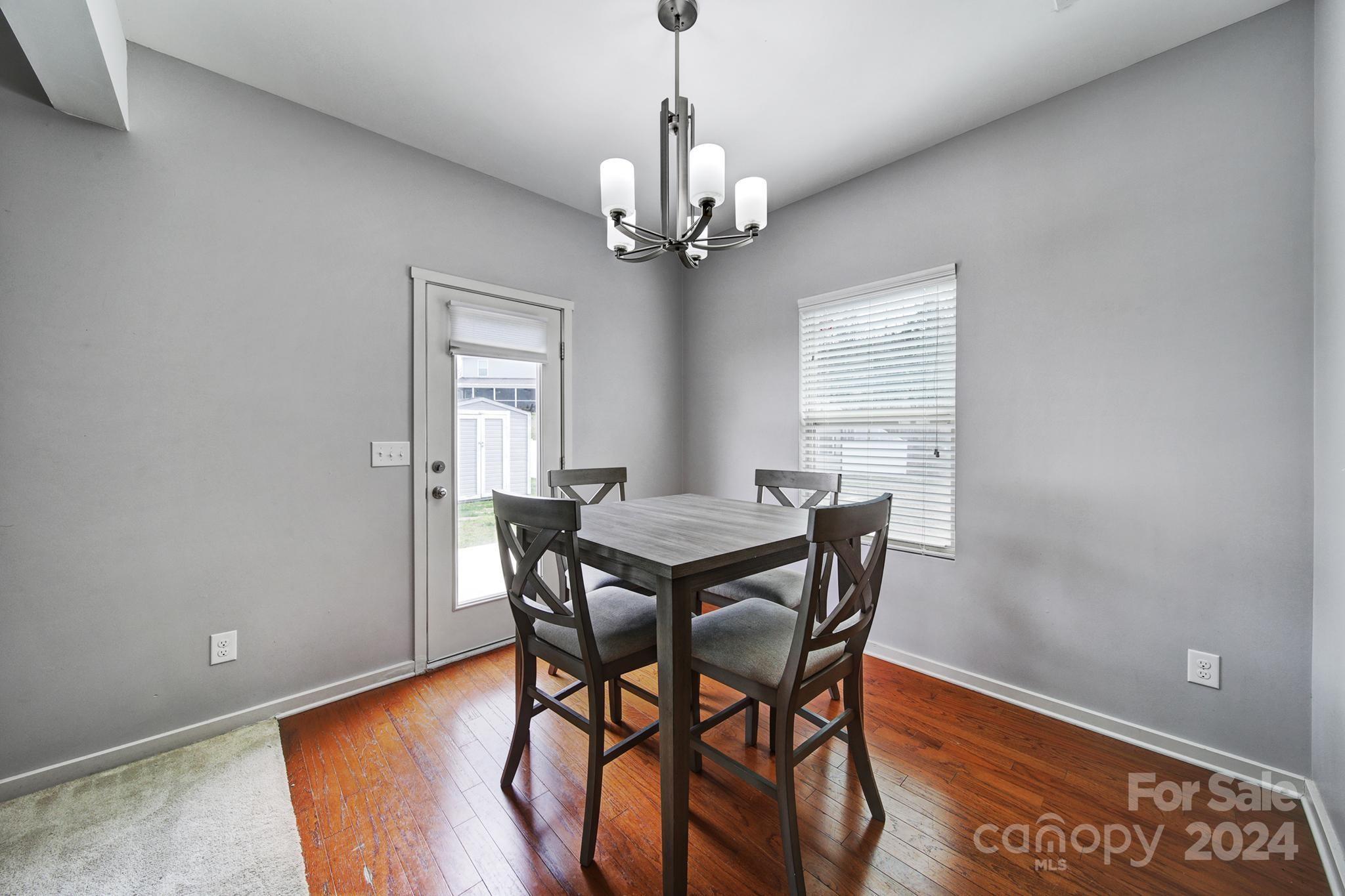 1539 Logan Patrick Court Gastonia, NC 28052 - Photo 6 of 26 a view of a dining room with furniture window and wooden floor
