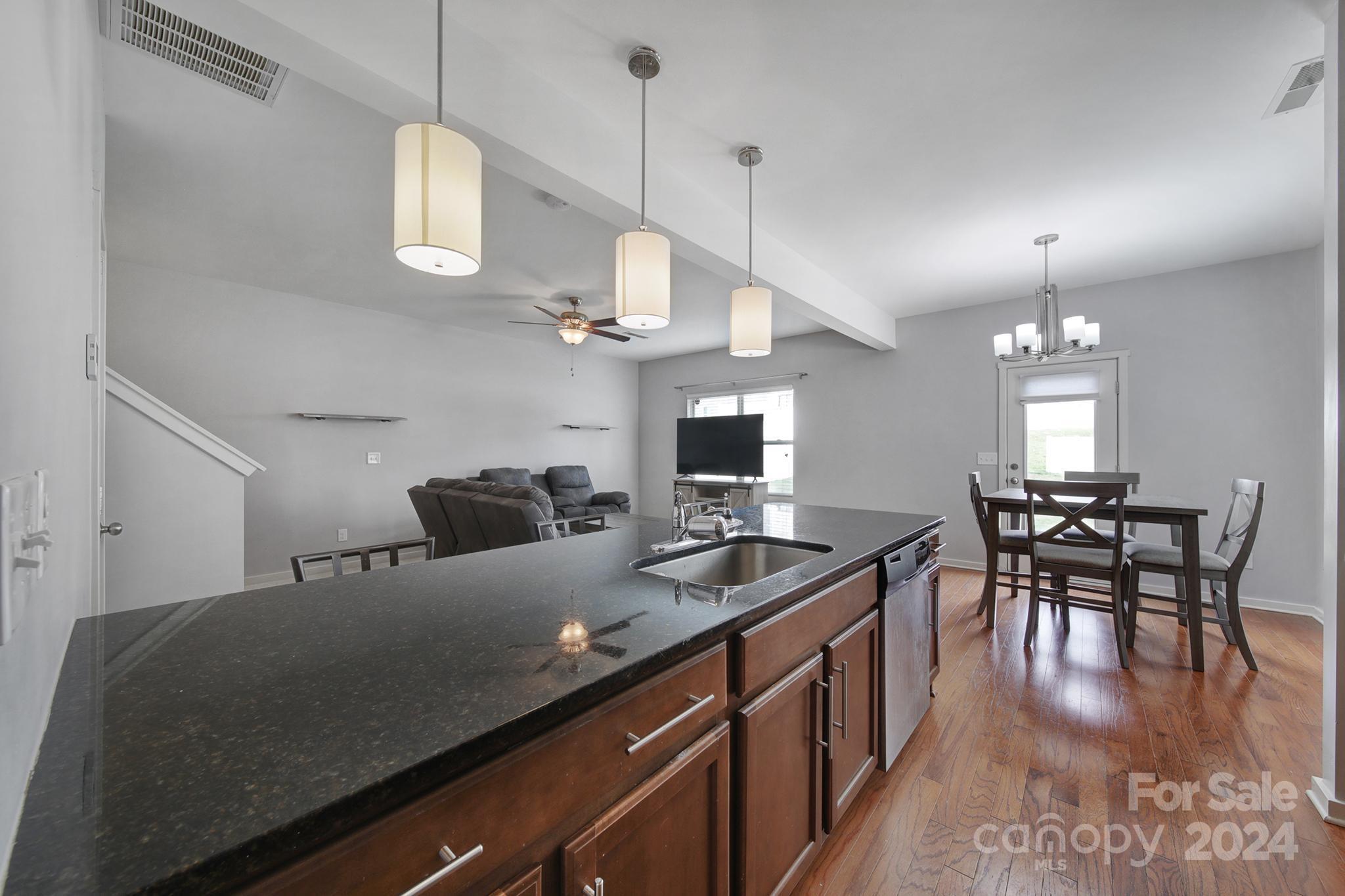 1539 Logan Patrick Court Gastonia, NC 28052 - Photo 9 of 26 a kitchen with cabinets table and chairs