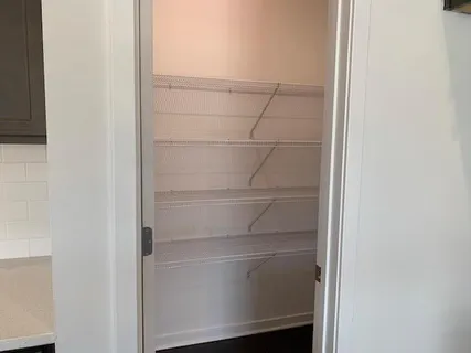 a empty closet with white paint