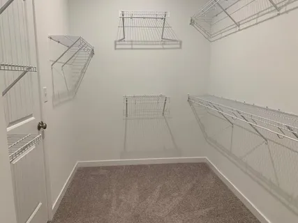 a view of a room with racks on the wall