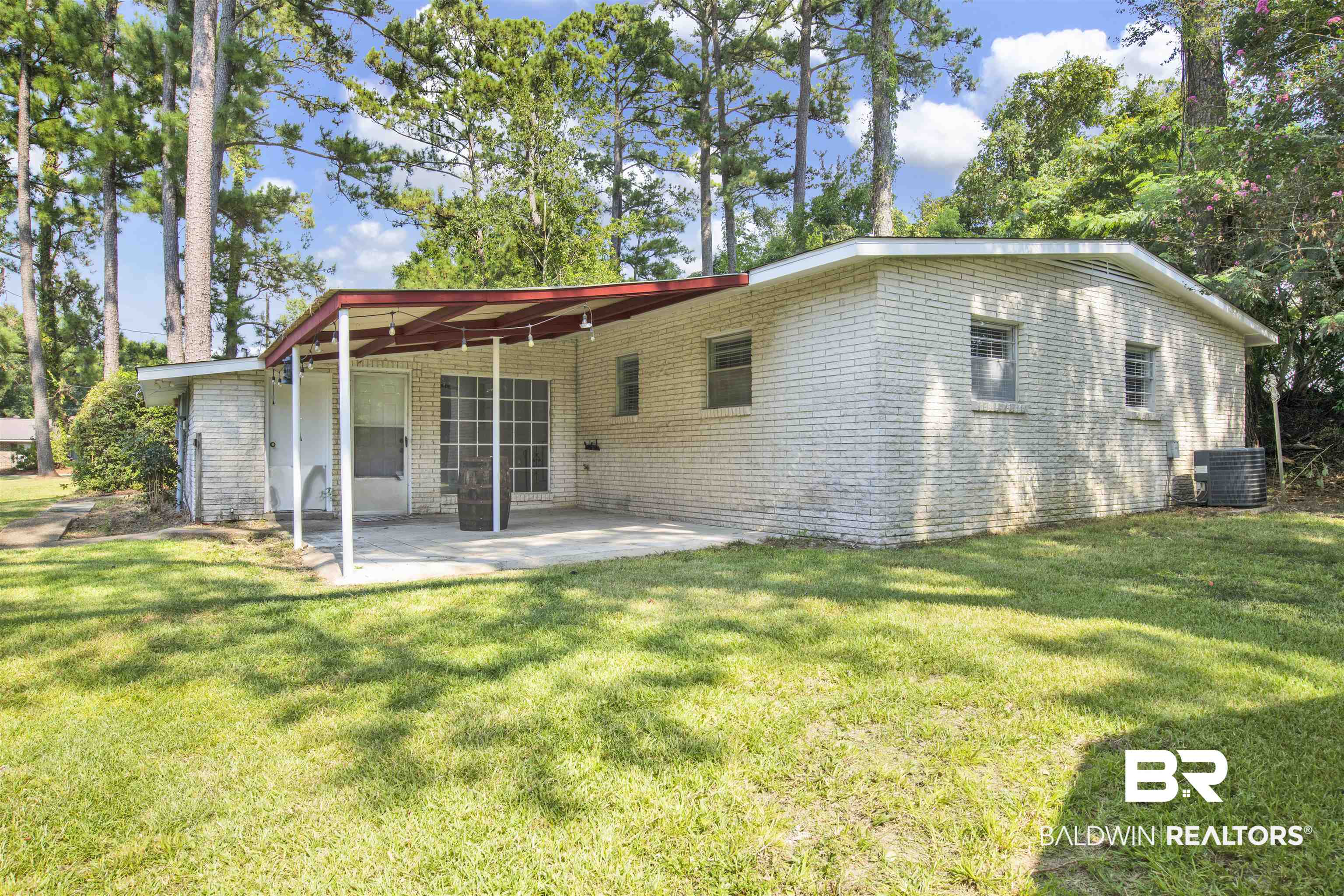 2 Lee Circle Daphne, AL 36527 - Photo 17 of 21 Rear view of property with central AC unit, a patio, and a lawn