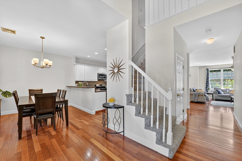15 Evergreen Circle, Unit 15 Canton, MA 02021 - Photo 5 of 29 a view of a dining room with furniture and wooden floor