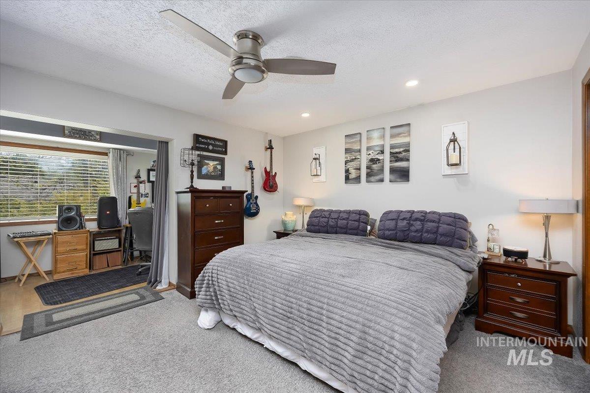 956 Bitterroot Place Twin Falls, ID 83301 - Photo 20 of 48 Spacious interior featuring light gray wall paint, recessed lighting, and a ceiling fan
