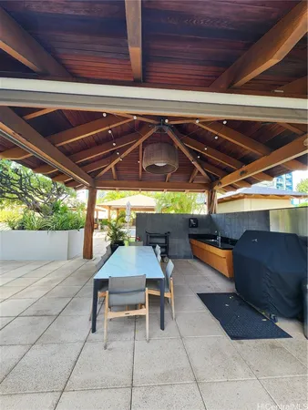 a view of a chairs and table in the patio