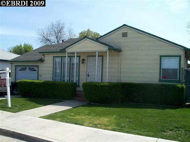 58 Service Road Antioch, CA 94509 - Photo 1 of 1 a front view of a house with garden