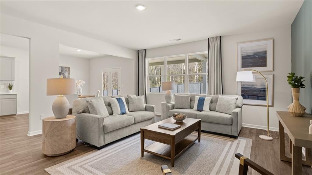 398 Bullock Pass Jefferson, GA 30549 - Photo 13 of 44 a living room with furniture and a large window