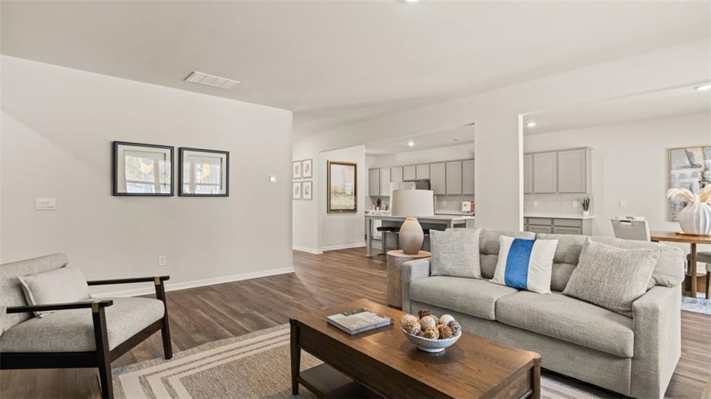 398 Bullock Pass Jefferson, GA 30549 - Photo 14 of 44 a living room with furniture kitchen view and a dining table