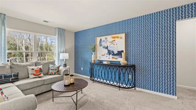 a living room with furniture and a rug