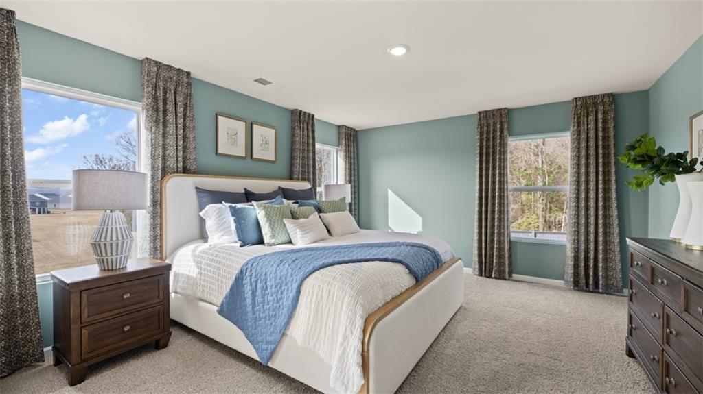 398 Bullock Pass Jefferson, GA 30549 - Photo 24 of 44 a bedroom with a bed and a window