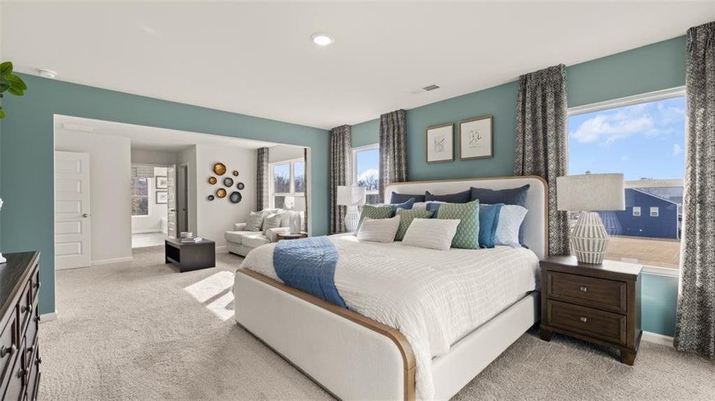 398 Bullock Pass Jefferson, GA 30549 - Photo 25 of 44 a bedroom with a large bed and a couch