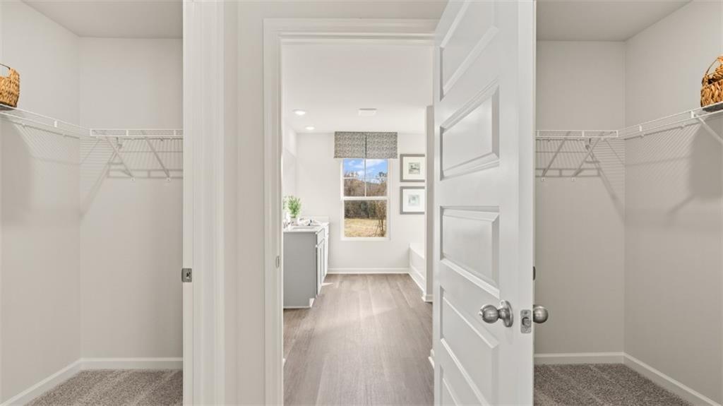 398 Bullock Pass Jefferson, GA 30549 - Photo 26 of 44 a view of a hallway with wooden floor and staircase