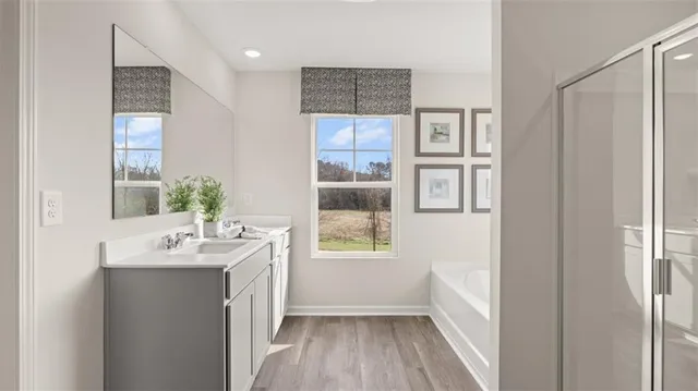 a bathroom with a sink a mirror and a bathtub