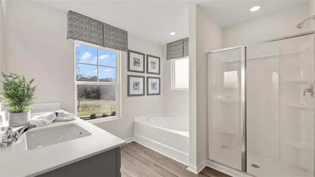 a white bath tub sitting next to a window