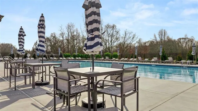 a view of a house with roof deck front of house