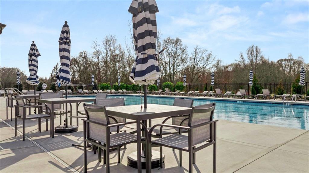 398 Bullock Pass Jefferson, GA 30549 - Photo 37 of 44 a view of a swimming pool with outdoor seating and city view