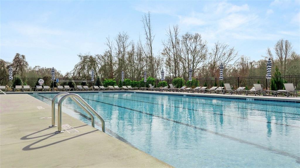 398 Bullock Pass Jefferson, GA 30549 - Photo 38 of 44 a view of swimming pool with outdoor seating and yard in the back