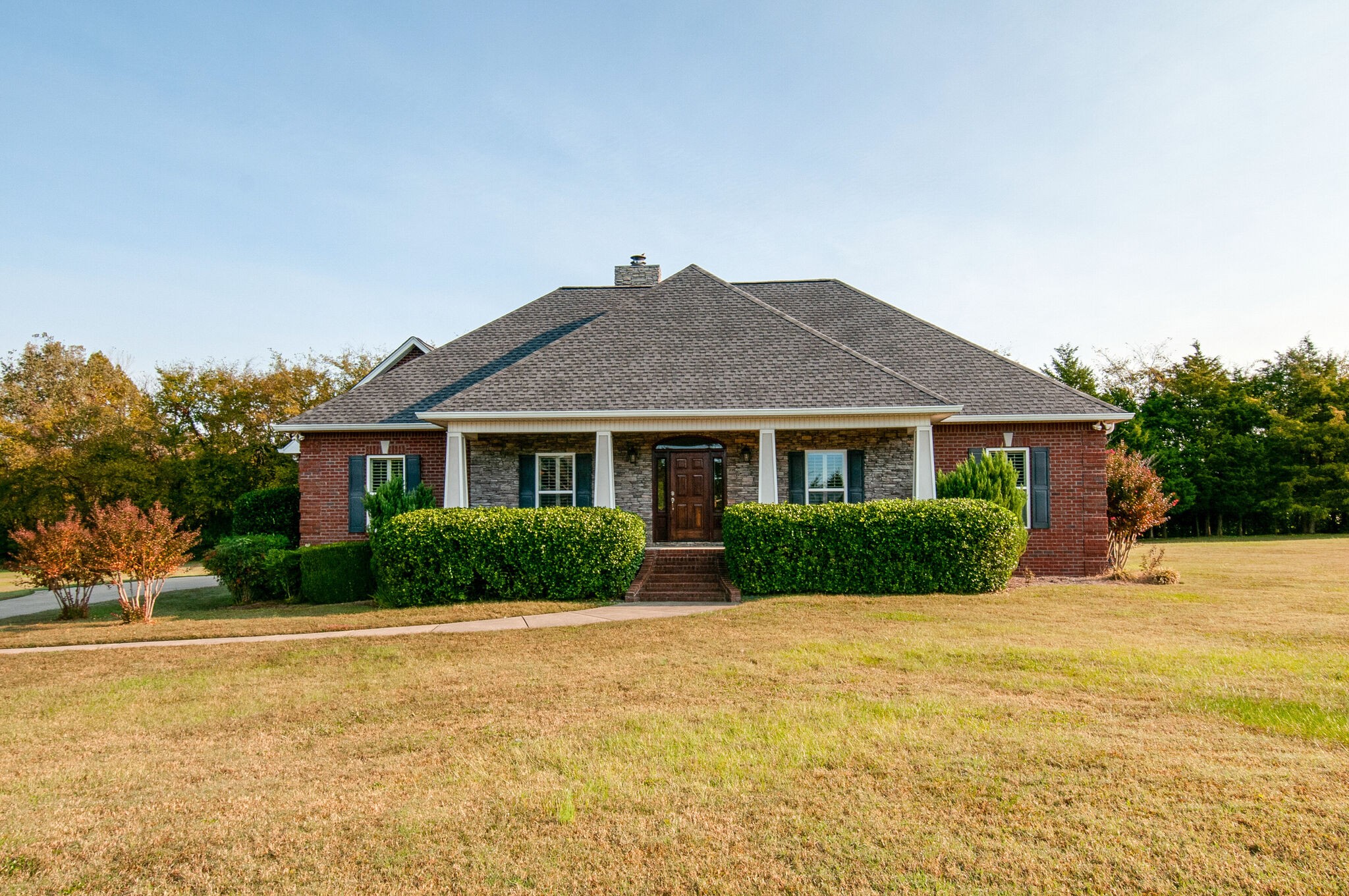a front view of a house with a yard