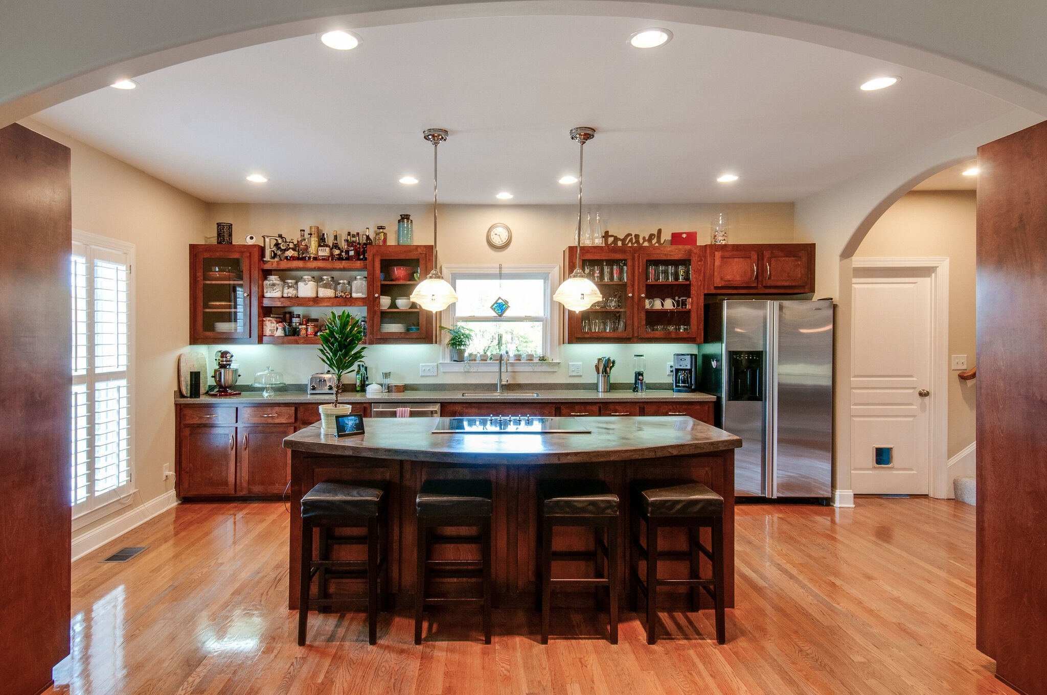 200 Ridgewater Way Mount Juliet, TN 37122 - Photo 10 of 37 a kitchen with stainless steel appliances kitchen island granite countertop a table chairs and a refrigerator