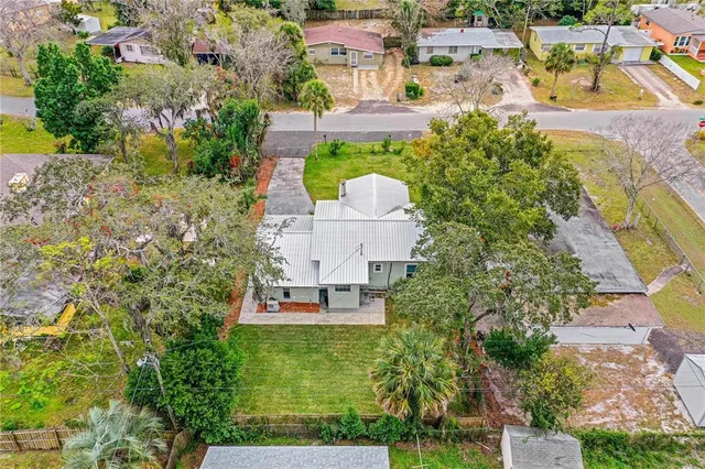 an aerial view of a house with a garden