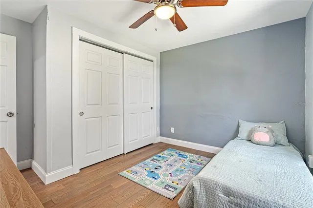 a bedroom with a bed and a lamp