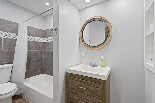 a bathroom with a sink a toilet and a bathtub