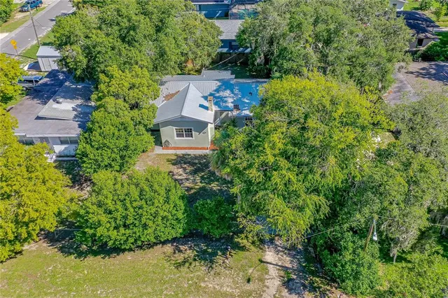 an aerial view of house with yard