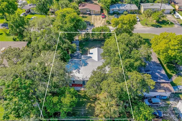 an aerial view of house with yard