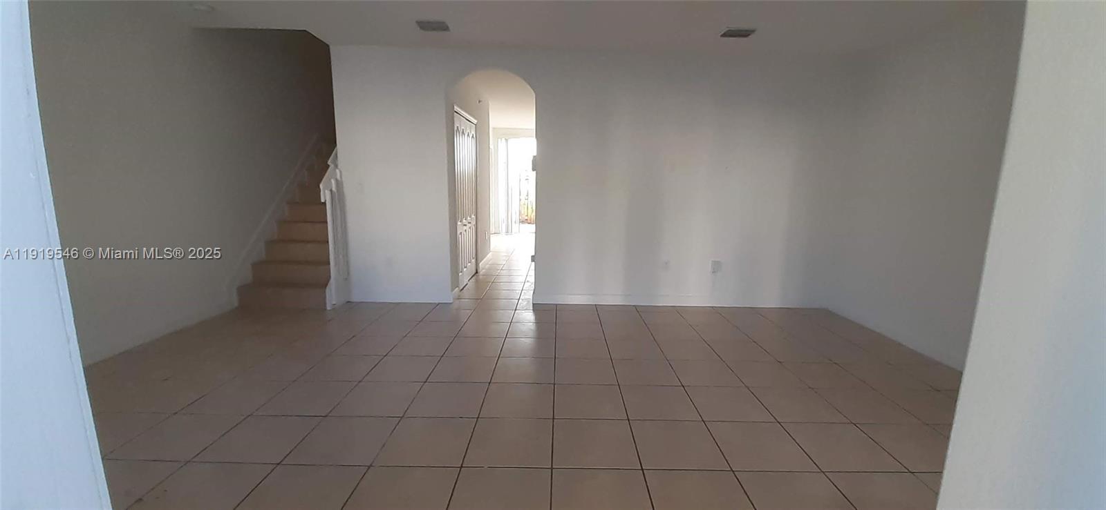 8091 West 36th Avenue, Unit 3 Hialeah, FL 33018 - Photo 11 of 16 en empty room with windows