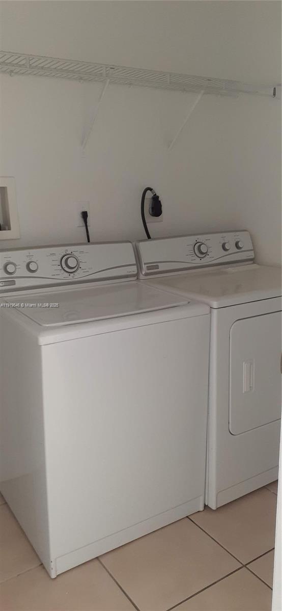 8091 West 36th Avenue, Unit 3 Hialeah, FL 33018 - Photo 8 of 16 a utility room with dryer and washer