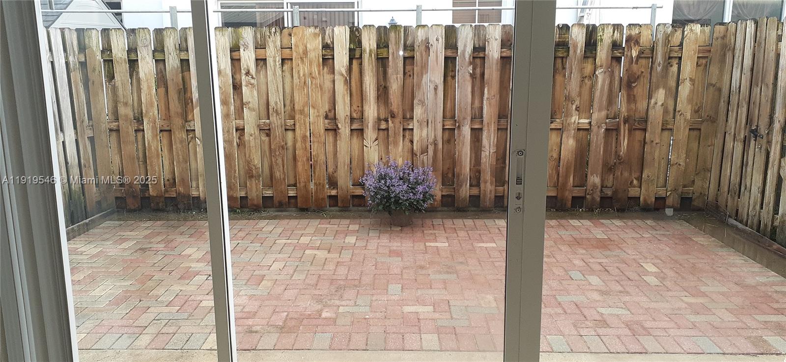 8091 West 36th Avenue, Unit 3 Hialeah, FL 33018 - Photo 10 of 16 a view of a wooden fence
