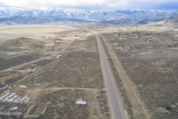 a view of a wooden floor with a view of the background