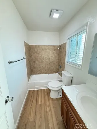 a bathroom with a toilet a sink and bathtub