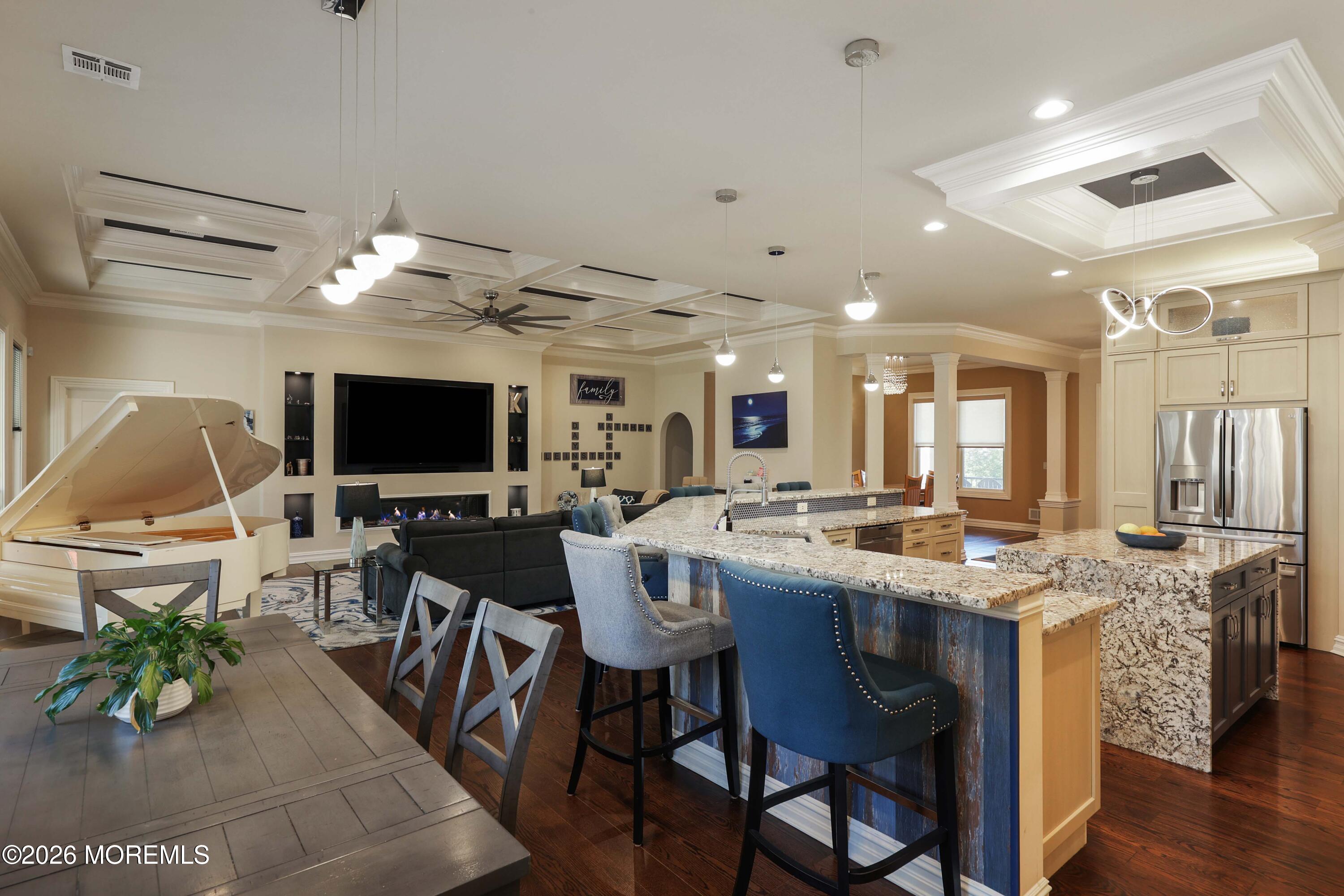 786 Holly Berry Lane Brick, NJ 08724 - Photo 12 of 52 a view of a dining room with furniture and a flat screen tv